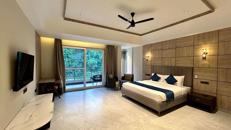 Premium Room at DLS Divine River Resort and Spa featuring a king bed TV and a private balcony with stunning views